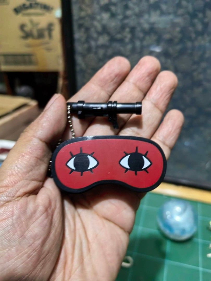 Keychain - Miniature Red Eye Mask (Category: Charms) located in Cebu City. Submitted by dudes_villanueva (Listing ID 1459934369, Image 3). Description: Keychain - Miniature Red Eye Mask Keychain 📌 Inspired by the character Sougo Okita from the anime Gintama, featuring his signature wide-open, cartoonish eye design. 📌 With Hidden compartment 📌 In excellent condition..