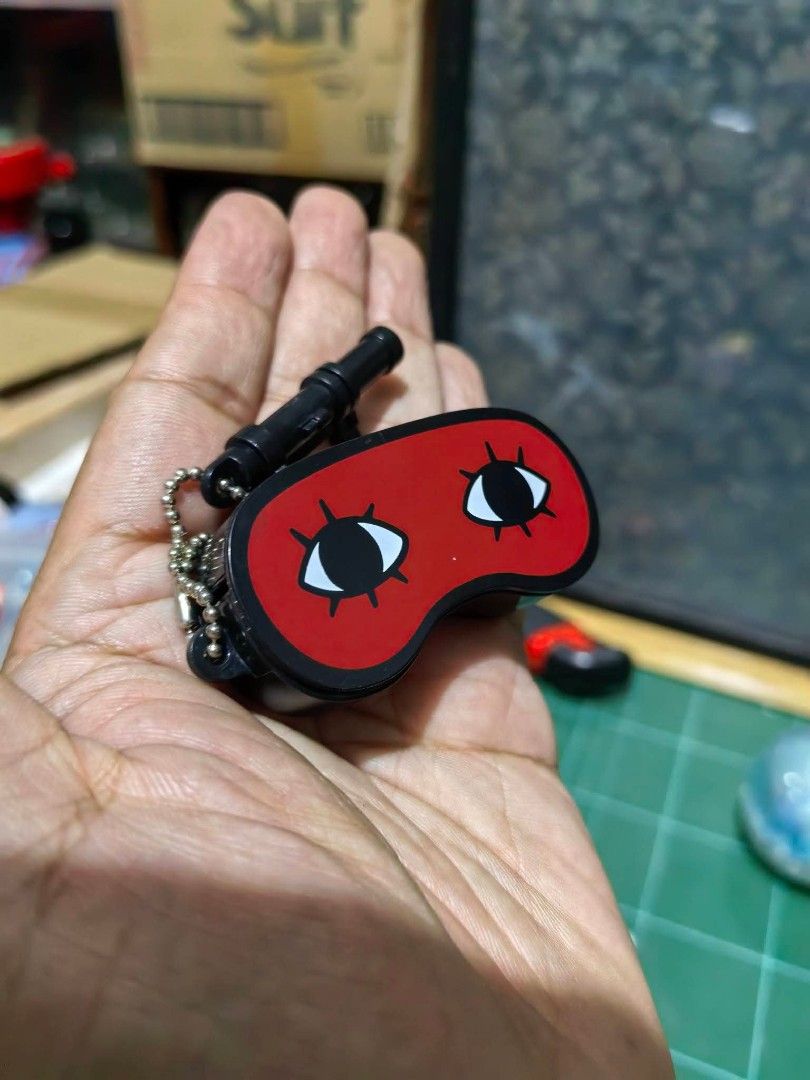 Keychain - Miniature Red Eye Mask (Category: Charms) located in Cebu City. Submitted by dudes_villanueva (Listing ID 1459934369, Image 1). Description: Keychain - Miniature Red Eye Mask Keychain 📌 Inspired by the character Sougo Okita from the anime Gintama, featuring his signature wide-open, cartoonish eye design. 📌 With Hidden compartment 📌 In excellent condition..