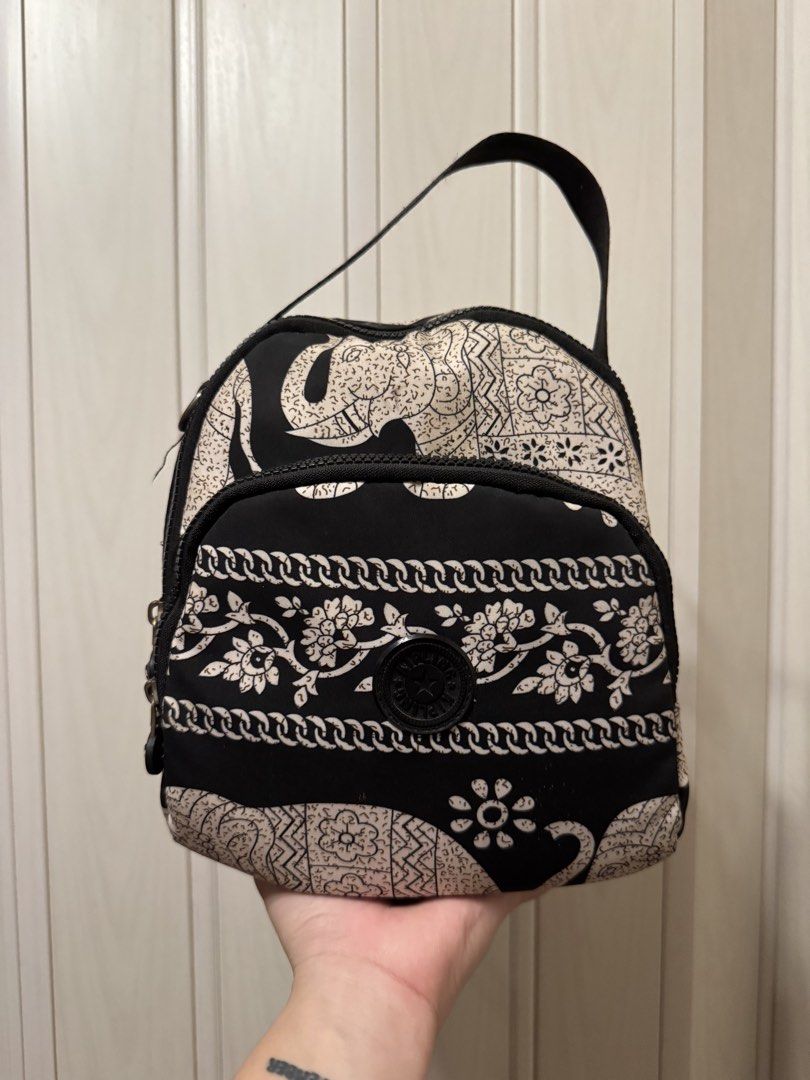Kipling Elephant Print Backpack (Category: Backpacks) located in Bacoor. Submitted by nicafindssince2022 (Listing ID 1459911161, Image 1). Description: - Adorable black and white elephant print design - Durable fabric for long-lasting use - Spacious main zippered compartment - Convenient front pocket for quick access - Metal D-rings on sides for versatile strap attachments - Ideal for everyday errands or your next adventure! - Tarnished metal har