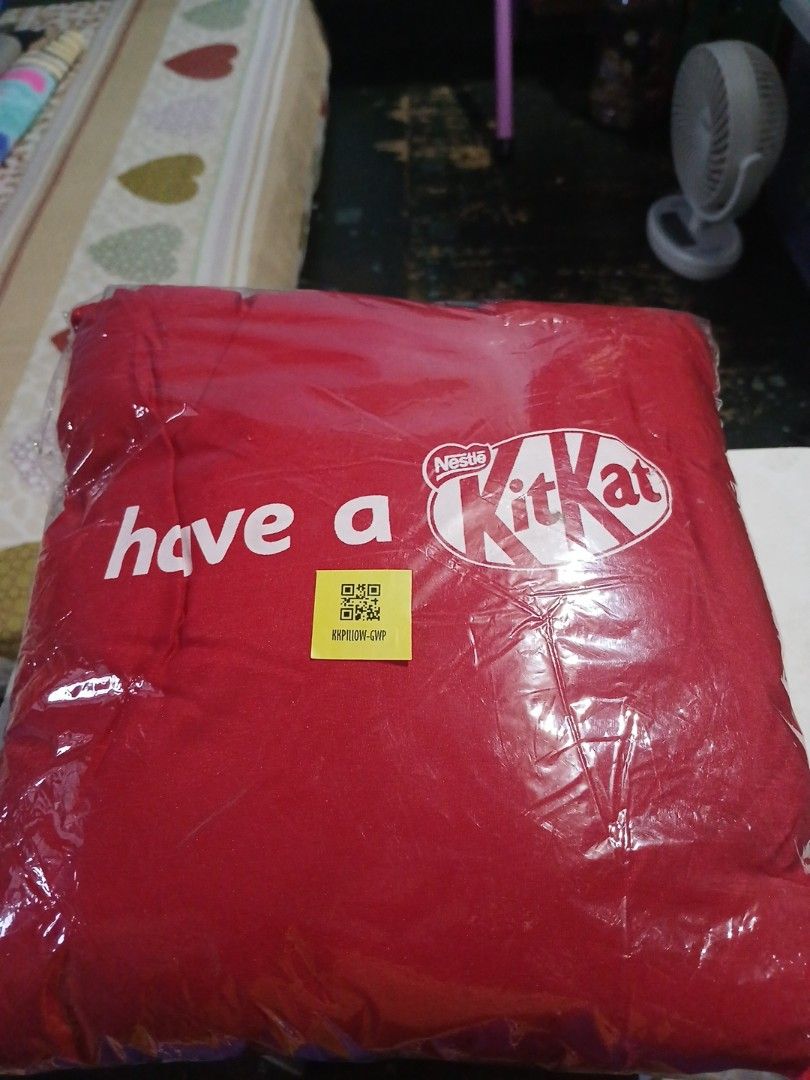 KitKat "Have a break" Red Pillow (Category: Bedding & Towels) located in Manila. Submitted by diczenestr94951 (Listing ID 1460010817, Image 1). Description: - Brand new red pillow with 'Have a break' text and KitKat logo. - Still in original packaging. - Ideal for KitKat enthusiasts or as a cozy sofa accent. - Measures approximately [insert size here if known]..