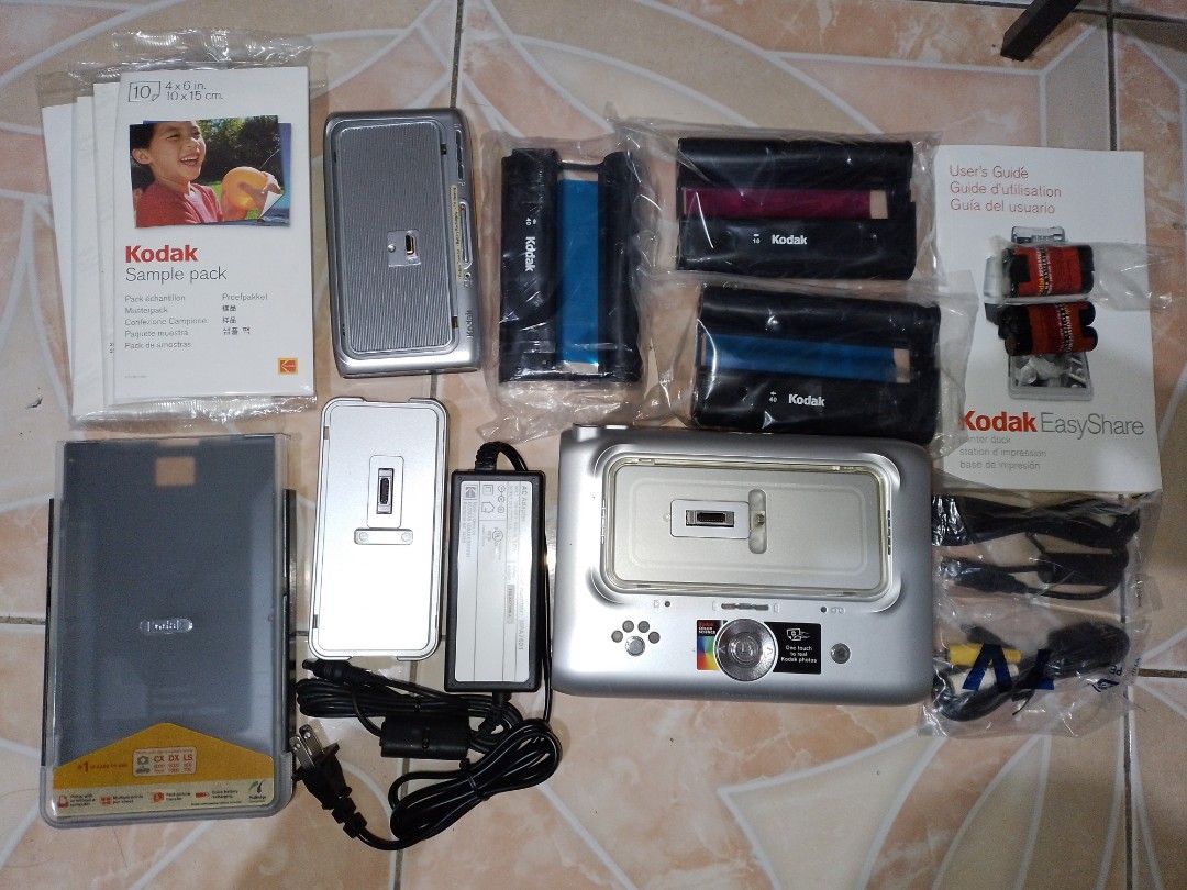 Kodak EasyShare Printer Dock with Sample Pack and Ink (Category: Cameras) located in Manila. Submitted by feelikesosa (Listing ID 1460095643, Image 1). Description: - Kodak EasyShare Printer Dock - Print photos directly from your camera - Includes sample photo paper pack - Includes ink cartridges - Comes with user guide - Includes power adapter - All items appear new and unused.