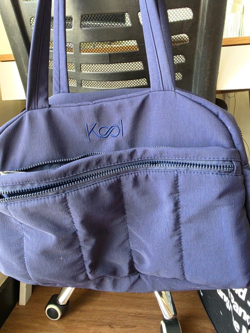 Kool Navy Blue Puffer Tote Bag (Category: Tote Bags) located in Manila. Submitted by leeeeei_tan (Listing ID 1459924299, Image 1). Description: - Navy blue Kool tote bag or sling bag - Multiple interior pockets for organization - Separate compartment for wet clothes - no issue - can fit up to 15" laptop - Ideal for everyday use or travel.