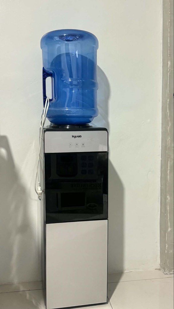 Kyowa Water Dispenser with Bottom Storage (Category: Water Purifiers & Dispensers) located in Manila. Submitted by aaayana123 (Listing ID 1460086082, Image 1). Description: Kyowa Water Dispenser - Hot & Cold. Includes storage compartment and water bottle. Works perfectly. Selling as I have a new one..
