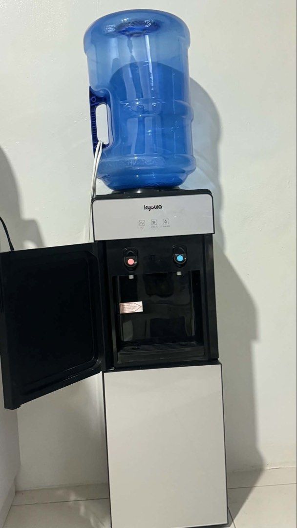 Kyowa Water Dispenser with Bottom Storage (Category: Water Purifiers & Dispensers) located in Manila. Submitted by aaayana123 (Listing ID 1460086082, Image 2). Description: Kyowa Water Dispenser - Hot & Cold. Includes storage compartment and water bottle. Works perfectly. Selling as I have a new one..