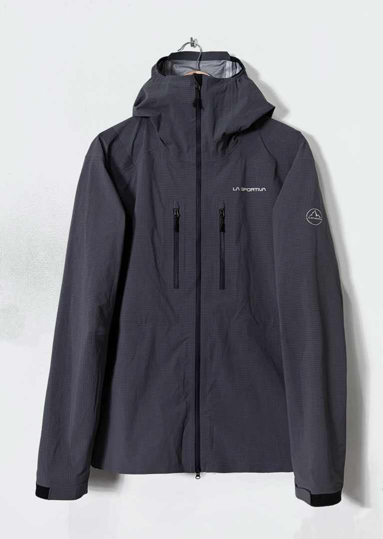 LA SPORTIVA HELIXIR SHELL RAIN JACKET in ONYX CHALK (Category: Coats, Jackets and Outerwear) located in Cavite. Submitted by frankiemnla (Listing ID 1459994305, Image 1). Description: L- 29 W- 25 Size- L to XL * Like new condition * Lightweight and highly durable waterproof shell * Spectra fiber offers a remarkable strength-to-weight ratio * Helmet-compatible hood with an elastic opening * Articulated elbows and shoulders enhance freedom of movem