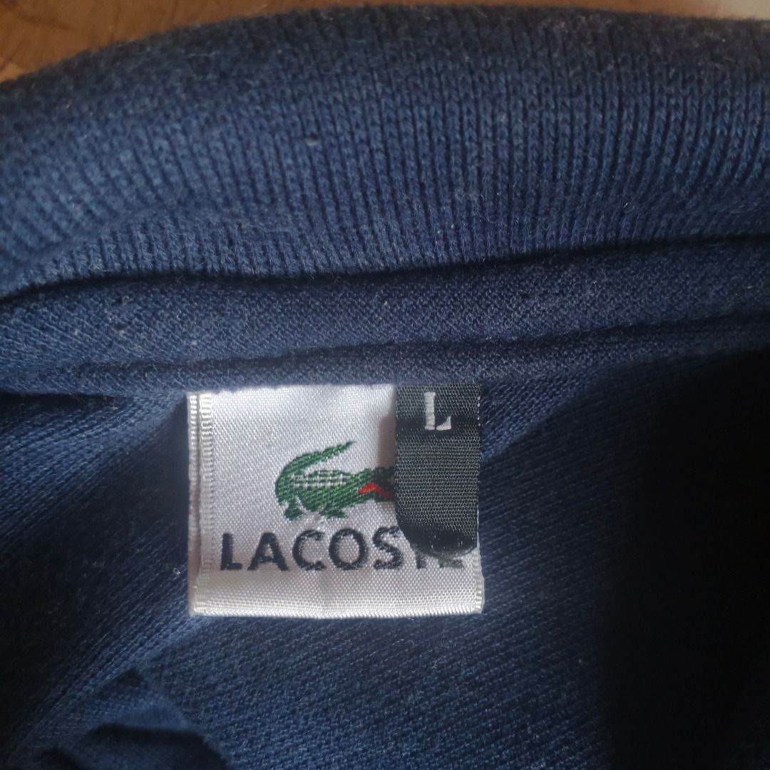 Lacoste (Category: Tshirts & Polo Shirts ) located in Paranaque City. Submitted by rociarra2019-99005 (Listing ID 1459903531, Image 3). Description: PICKUP ONLY navy blue Lacoste polo shirt - Size: L - Iconic embroidered crocodile logo on chest - Comfortable 100% cotton material shoulder to shoulder from back = 47cm length from back= 67cm .