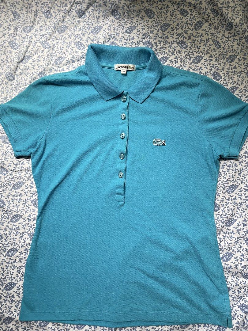 Lacoste Blue Polo Shirt Size 38 (Category: Shirts) located in General Trias. Submitted by lyzcollections. (Listing ID 1459905865, Image 2). Description: - Classic blue Lacoste polo shirt - Iconic crocodile logo on chest - Button-up neckline - Size 38 - Ideal for casual or sporty outfits.