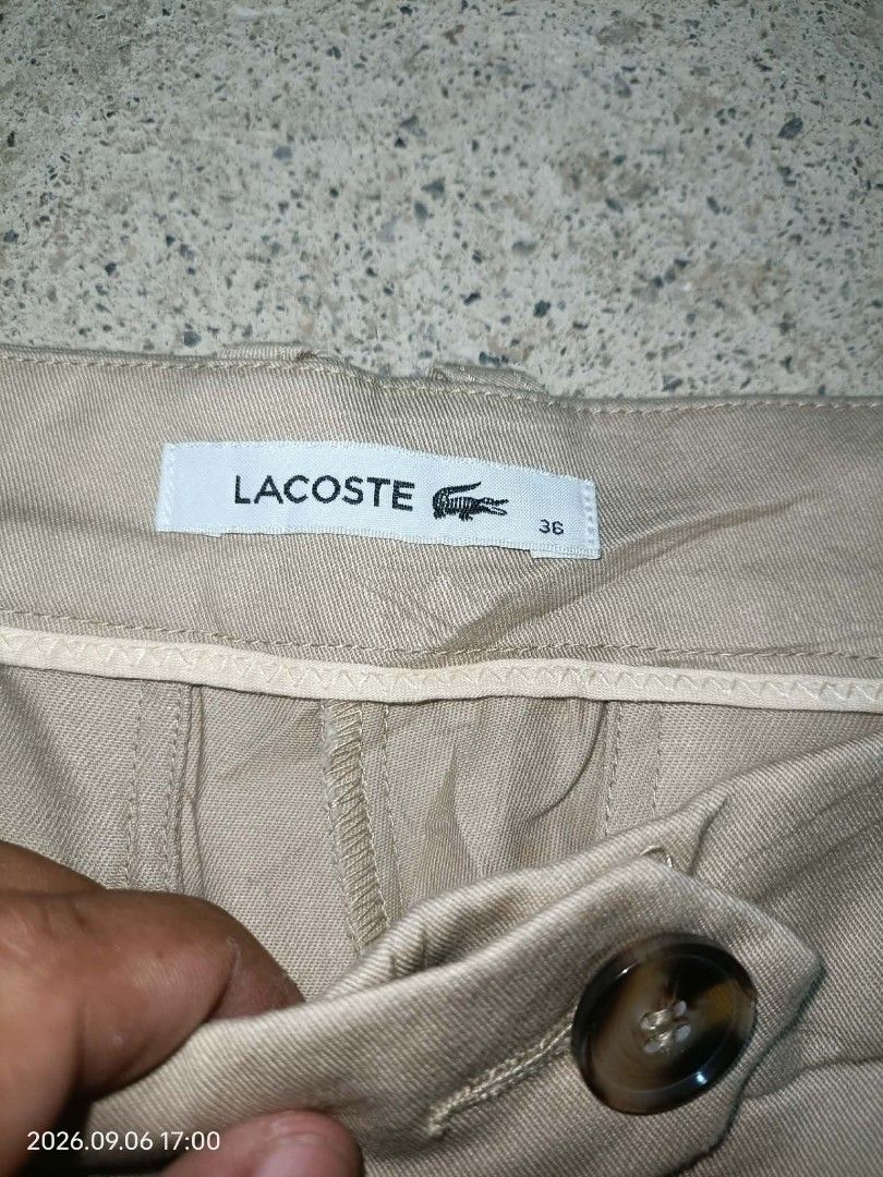 Lacoste Chino pants (Category: Luxury Apparel) located in Alburquerque. Submitted by ayrelieonlineshop (Listing ID 1460049345, Image 1). Description: Lacoste Chino pants size 36 dimensions W 30-31 L-36 hem 7 as new condition no pinhole or punit.