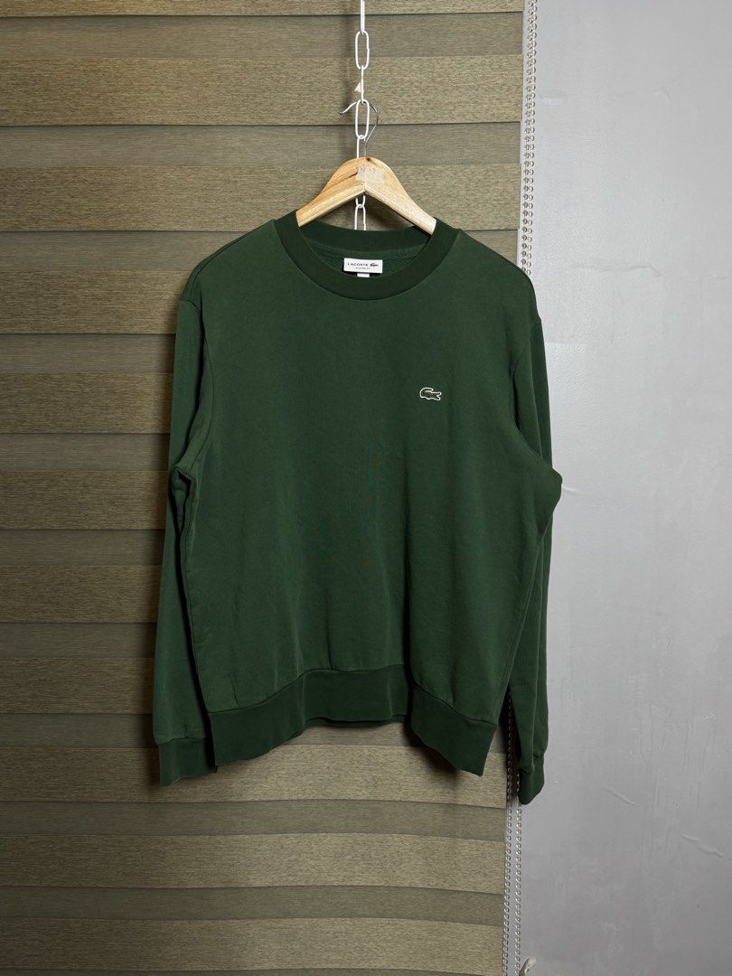 Lacoste forest green sweater (Category: Hoodies) located in Santa Ana. Submitted by thrift.sanctuary (Listing ID 1460081986, Image 1). Description: 27,23 dark green lacoste, like new condi.