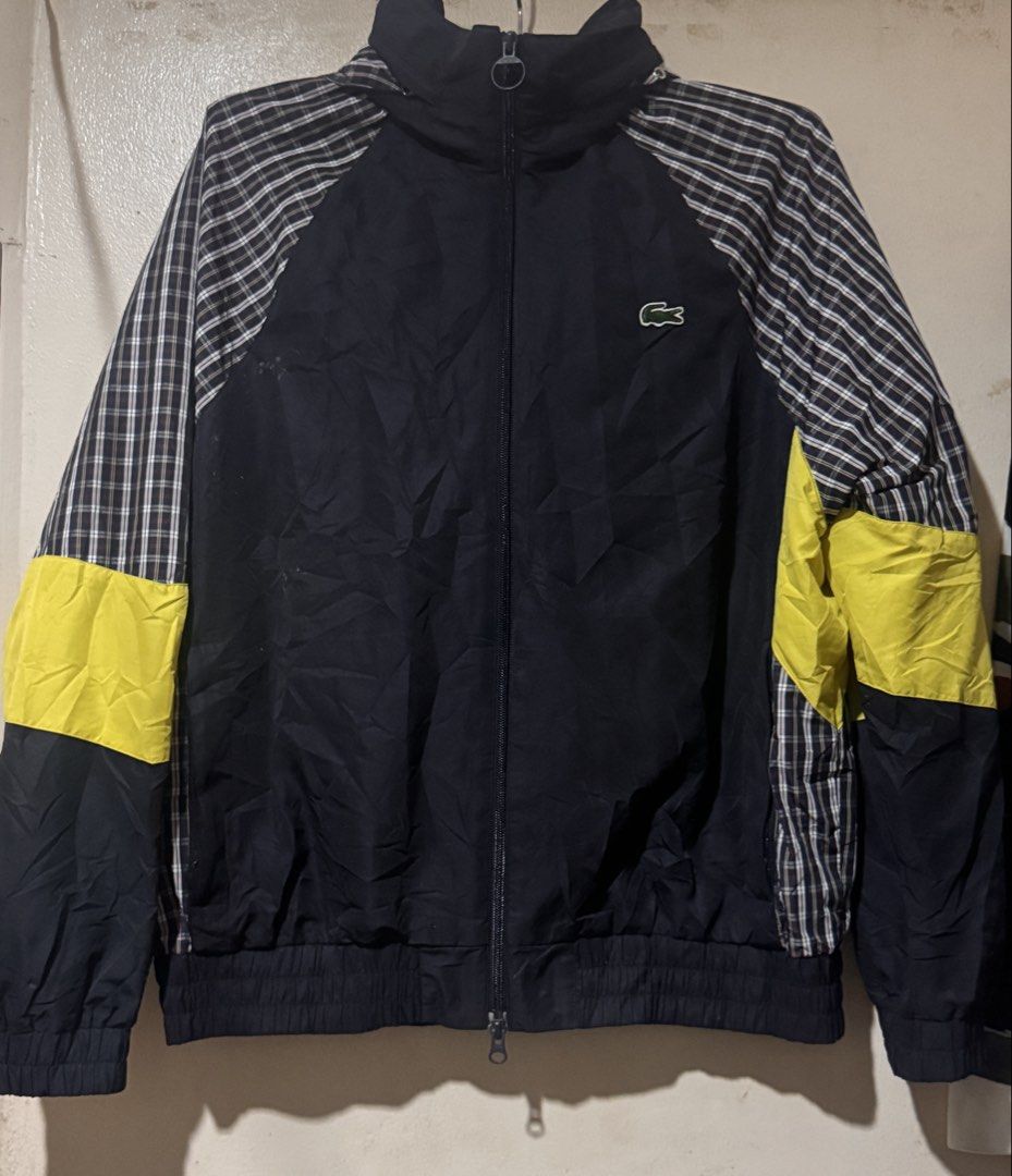 Lacoste L!VE Check Switch Track Jacket (Category: Coats, Jackets and Outerwear) located in Danao, Cebu. Submitted by welvirinec29053 (Listing ID 1459933668, Image 1). Description: Lacoste L!VE Check Switch Track Jacket in black with plaid patterned sleeves and bright yellow colorblock accents. with hoodie Size M Dimes 25x27 Color rate 10/10.