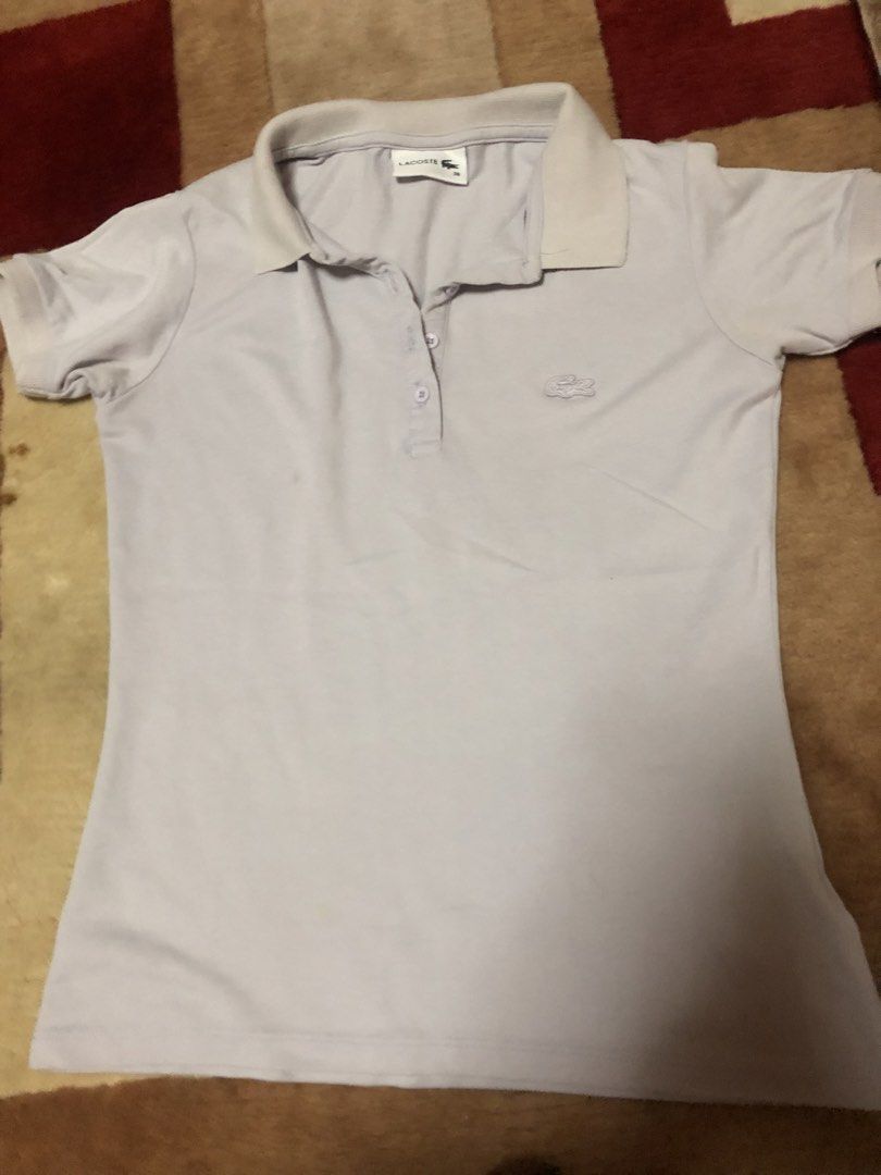Lacoste Polo Shirt - Light Purple (Category: Shirts) located in Bulacan. Submitted by shinzyx (Listing ID 1460020101, Image 1). Description: - Light purple Lacoste polo shirt - Size 38 - Short sleeves with collar and button closure - Iconic embroidered Lacoste crocodile logo on chest - Ideal for casual or sporty outfits.