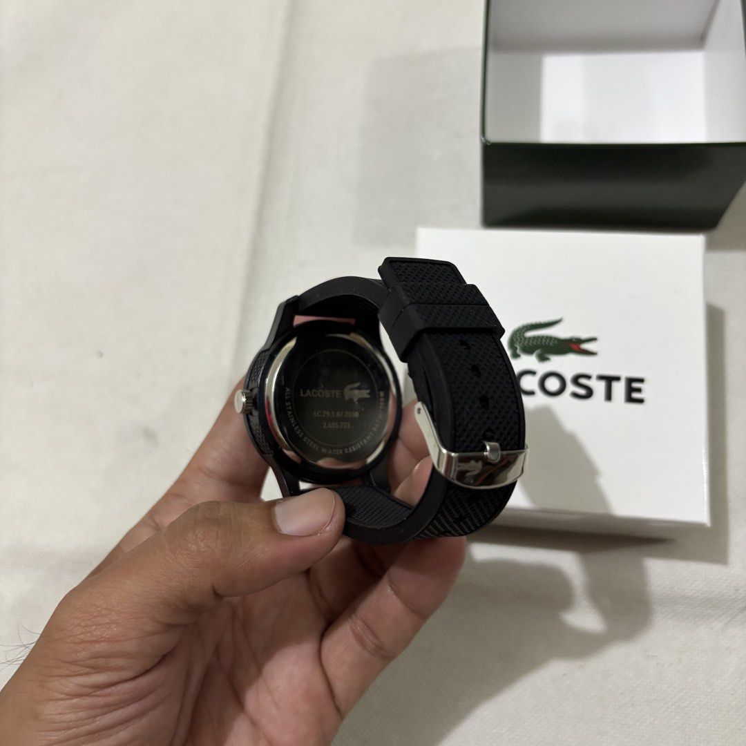 Lacoste Quartz Watch Black (Category: Women's Watches) located in Manila. Submitted by lestr.g (Listing ID 1460037888, Image 2). Description: - Black Lacoste watch - Dark red face - Quartz movement - Water resistant - Comes with original box - Ideal for everyday wear.