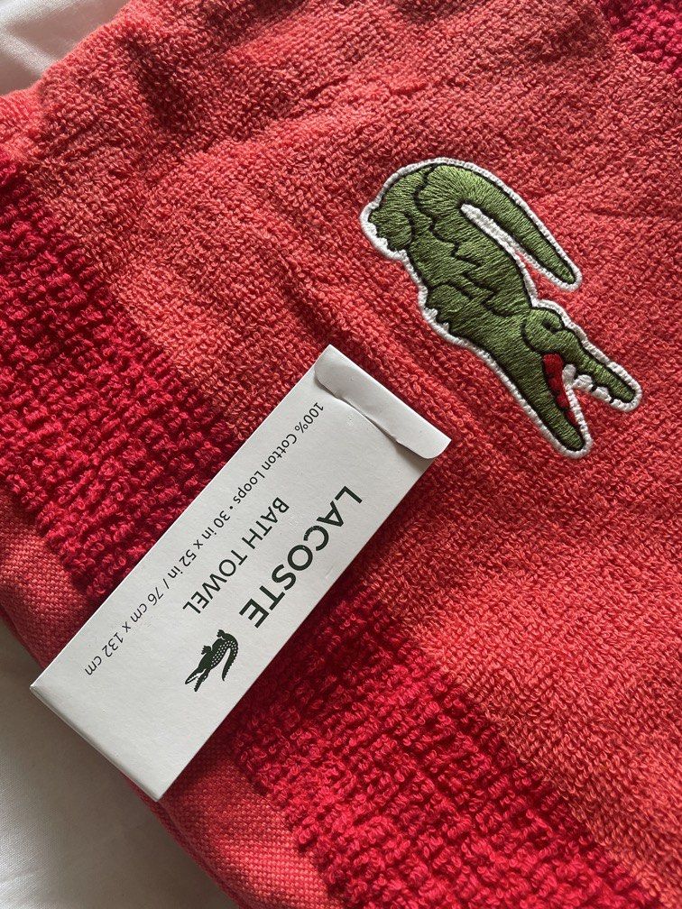 Lacoste red bath towel (Category: Bedding & Towels) located in Dinalupihan. Submitted by closetbymint (Listing ID 1459925876, Image 2). Description: .