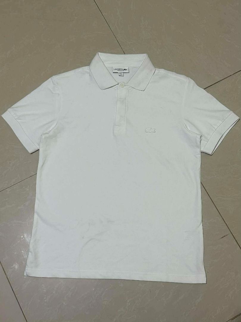 Lacoste Regular Fit White Polo Shirt (Category: Tshirts & Polo Shirts ) located in Caloocan City. Submitted by newmetho (Listing ID 1459998901, Image 1). Description: size 4 no issue need wash.