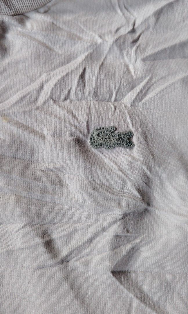 Lacoste white shirt (Category: Tshirts & Polo Shirts ) located in Cagayan de Oro. Submitted by johnzj002 (Listing ID 1460054706, Image 3). Description: Size L Issue need wash galing pa bulto Dimes 21x27.