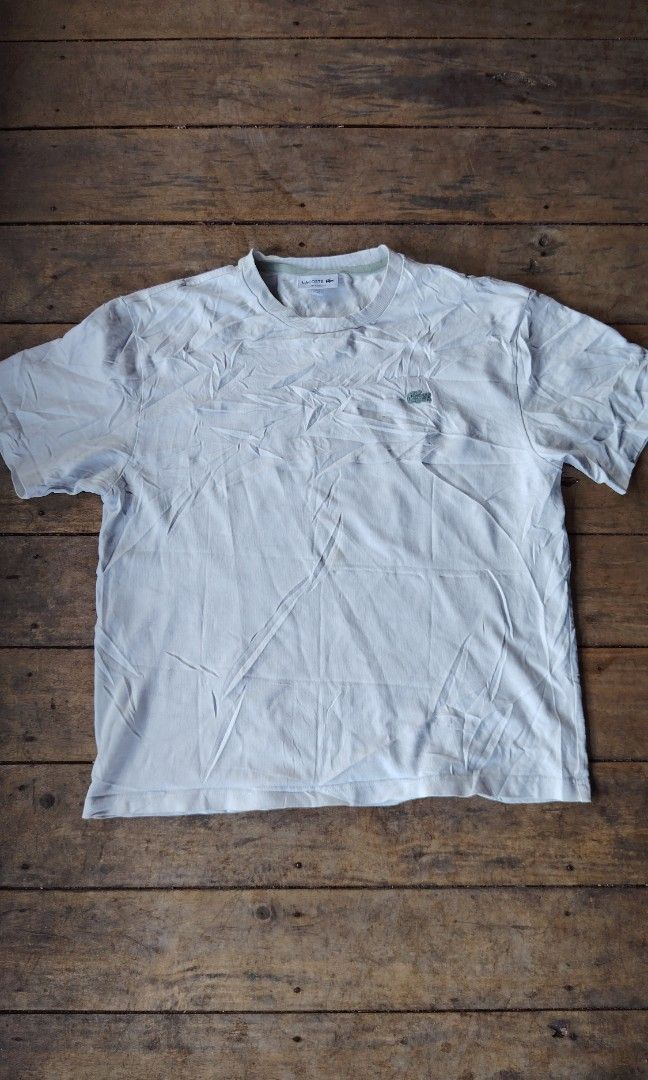Lacoste white shirt (Category: Tshirts & Polo Shirts ) located in Cagayan de Oro. Submitted by johnzj002 (Listing ID 1460054706, Image 1). Description: Size L Issue need wash galing pa bulto Dimes 21x27.