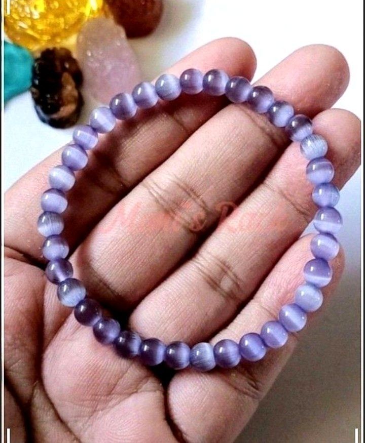 Lavender Cat's Eye Bracelet (Category: Bracelets) located in Taguig. Submitted by mimisrack (Listing ID 1460020862, Image 1). Description: 💜Soft dreamy lavender tones with a glowing cat's eye effect that shifts beautifully under light - elegant, calming, and easy to wear daily -Features a silky luminous "cat's eye" shimmer effect -Often associated with calmness, focus, intuition, and protection -A simple yet enchanting bracelet with a magical gl