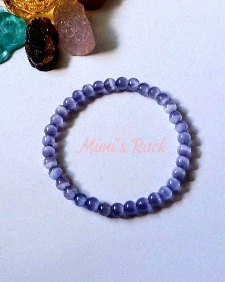 Lavender Cat's Eye Bracelet (Category: Bracelets) located in Taguig. Submitted by mimisrack (Listing ID 1460020862, Image 3). Description: 💜Soft dreamy lavender tones with a glowing cat's eye effect that shifts beautifully under light - elegant, calming, and easy to wear daily -Features a silky luminous "cat's eye" shimmer effect -Often associated with calmness, focus, intuition, and protection -A simple yet enchanting bracelet with a magical gl