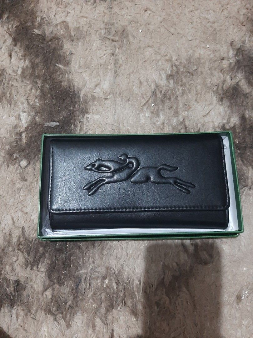 LC Long Wallet (Category: Wallets & Card holders) located in Davao. Submitted by nisa_chan04 (Listing ID 1460073799, Image 2). Description: - Long size wallet - Available colors: Black, Brown, Taupe - Kiss lock/snap button, with zipper pocket inside. - Comes with box - Ideal for organizing essentials.
