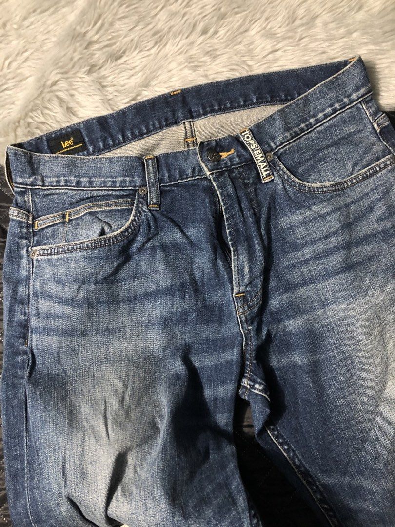 Lee Jeans Regular Fit Distressed Denim (Category: Jeans) located in Baguio. Submitted by mekabee_moon (Listing ID 1460056211, Image 2). Description: - Brand: Lee Jeans - Fit: Regular - Wash: Classic blue denim - Features: Distressed details, small rip on right leg - Style: Comfortable for everyday wear WAISTLINE:32-34 via tape measure.