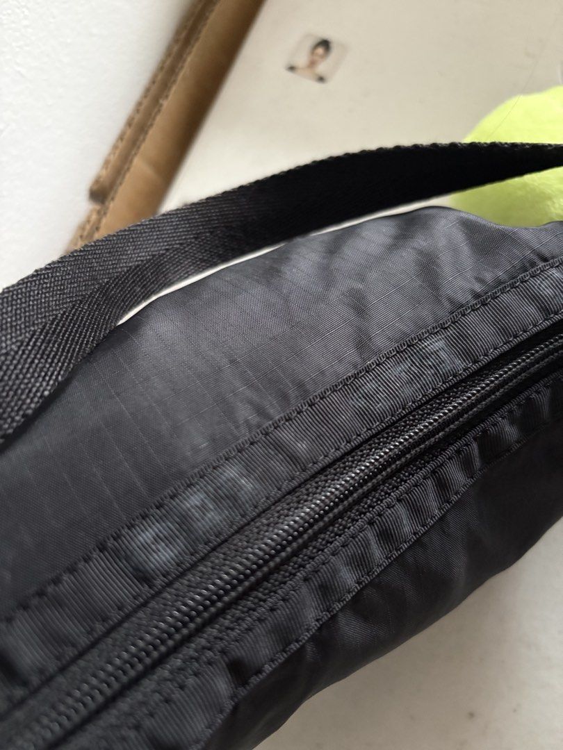 Lesportsac Nylon Kili Bag (Category: Shoulder Bags) located in Quezon City. Submitted by wonderp1e (Listing ID 1460013304, Image 3). Description: Black kili bag Can fit a small umbrella Issue: faded na tatak sa may bandang zipper Negotiable.