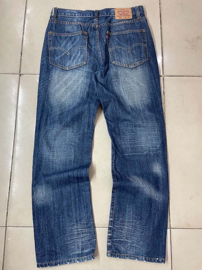 Levi's 501 Button Fly Denim Jeans (Category: Jeans) located in Cainta. Submitted by mariss.luxx (Listing ID 1460027101, Image 1). Description: - Classic Levi's 501 jeans - Button fly closure - Medium wash denim with fading and whiskering - Straight leg fit - Orange contrast stitching - Ideal for everyday wear.