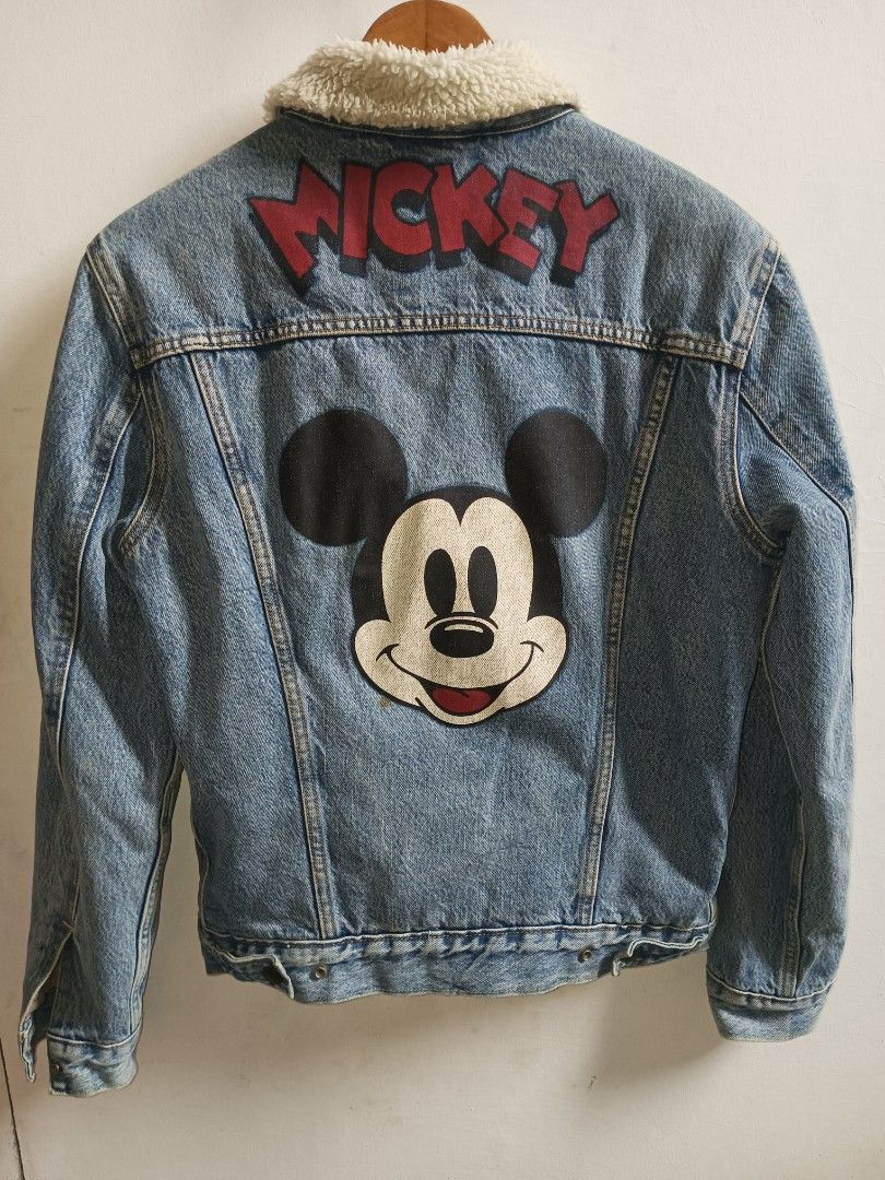 Levi's Denim Sherpa Jacket Mickey Mouse Edition Size S (Category: Coats, Jackets and Outerwear) located in Jolo. Submitted by zah-zah (Listing ID 1460012789, Image 2). Description: - Cool Levi's denim jacket - Cozy sherpa lining for warmth - Fun Mickey Mouse graphic on the back - Small Mickey detail on the chest - Classic button closure - Made in China.