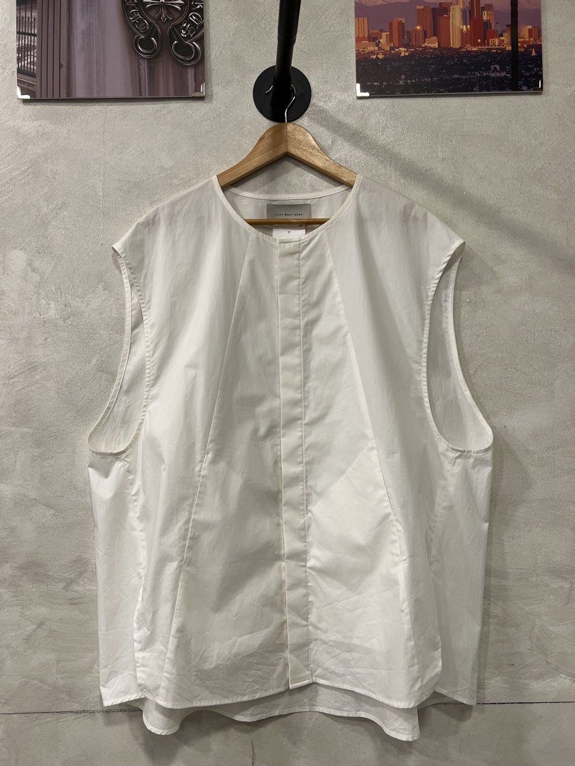 Licht Bestreben Utility Inner Shirt (Category: Sets & Coordinates) located in Manila. Submitted by -handpick- (Listing ID 1459948534, Image 1). Description: This is a white sleeveless shirt vest from Licht Bestreben featuring distinct structural paneling down the front. -Free size Dimensions : Length: 30 to 32 inches Width: 28 inches Shoulder : 22 inches Sign of wear in good condition .