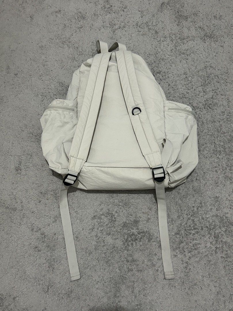 GU nylon backpack (Category: Backpacks) located in Manila. Submitted by acesarchive (Listing ID 1460062231, Image 2). Description: GU nylon backpack in off white 🤍 ⟡ lightweight nylon material ⟡ strings and zippers are in good condition ⟡ purchased from GU japan.