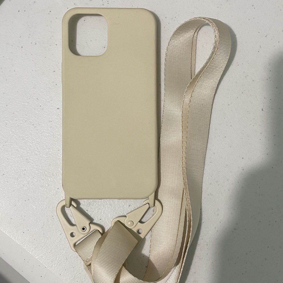 Light Beige Lanyard Case for iPhone 12 Pro Max (Category: Cases & Sleeves) located in Subic. Submitted by pepaydeclutters (Listing ID 1460094764, Image 3). Description: Used once then left in storage No stains/defects Comes with adjustable and removable strap (up to 150cm in length) Sturdy hardware! Perfect for clerkship/internship/travelling.