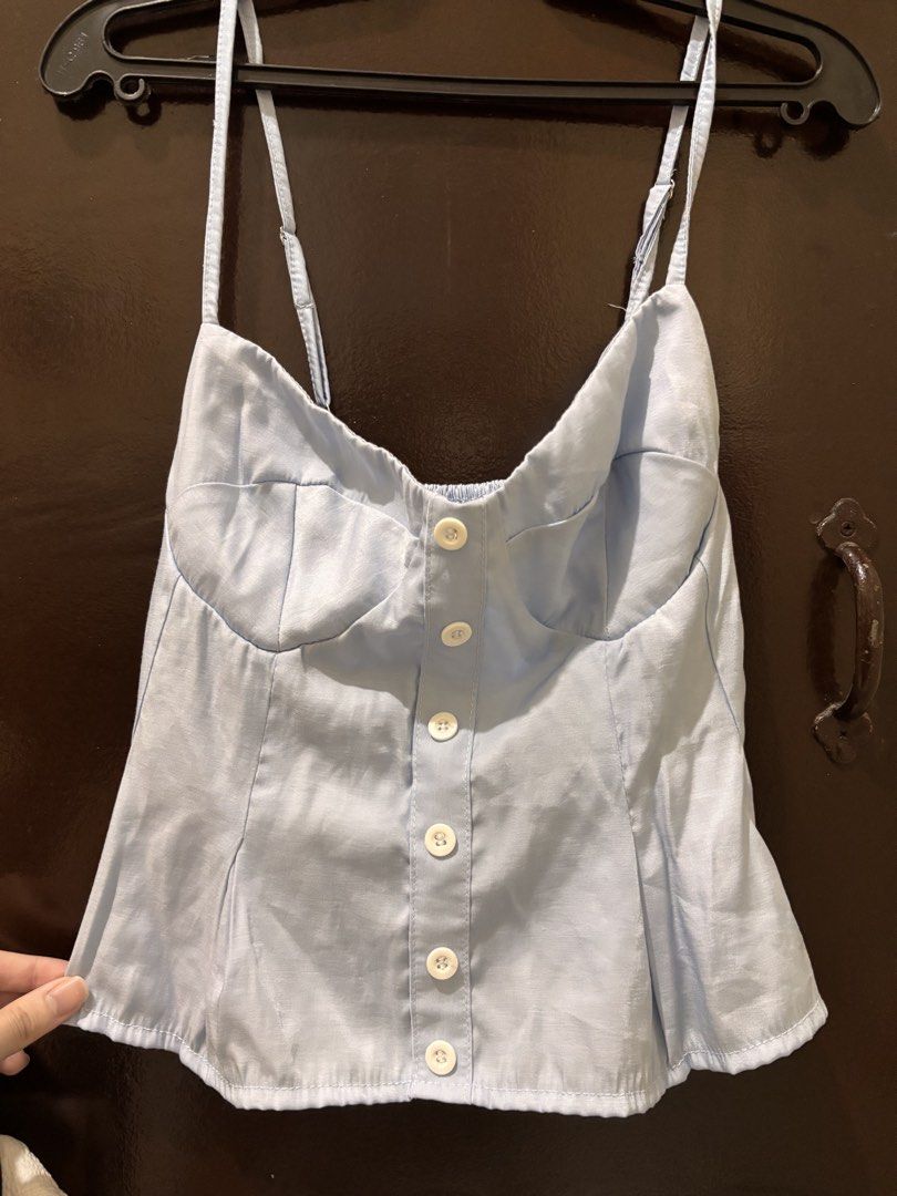 Light Blue Smocked Back Camisole Top (Category: Sleeveless) located in Valenzuela. Submitted by chamenamena (Listing ID 1459969468, Image 1). Description: - Cute light blue camisole top - Button front detail - Adjustable straps - Smocked back for a comfy fit - Peplum hem .