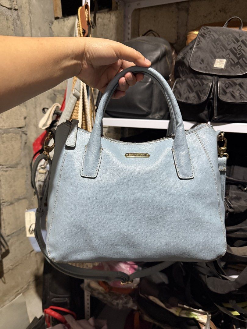 Light Blue Textured Handbag with Shoulder Strap (Category: Shoulder Bags) located in Mainit. Submitted by cherpaulassortedshop (Listing ID 1460029052, Image 1). Description: - Light blue textured handbag - Zip closure on top - Back zip pocket for extra storage - Detachable shoulder strap for versatility - Elegant gold hardware details - Clean and well-maintained interior - Ideal everyday bag Ukay ukay source.