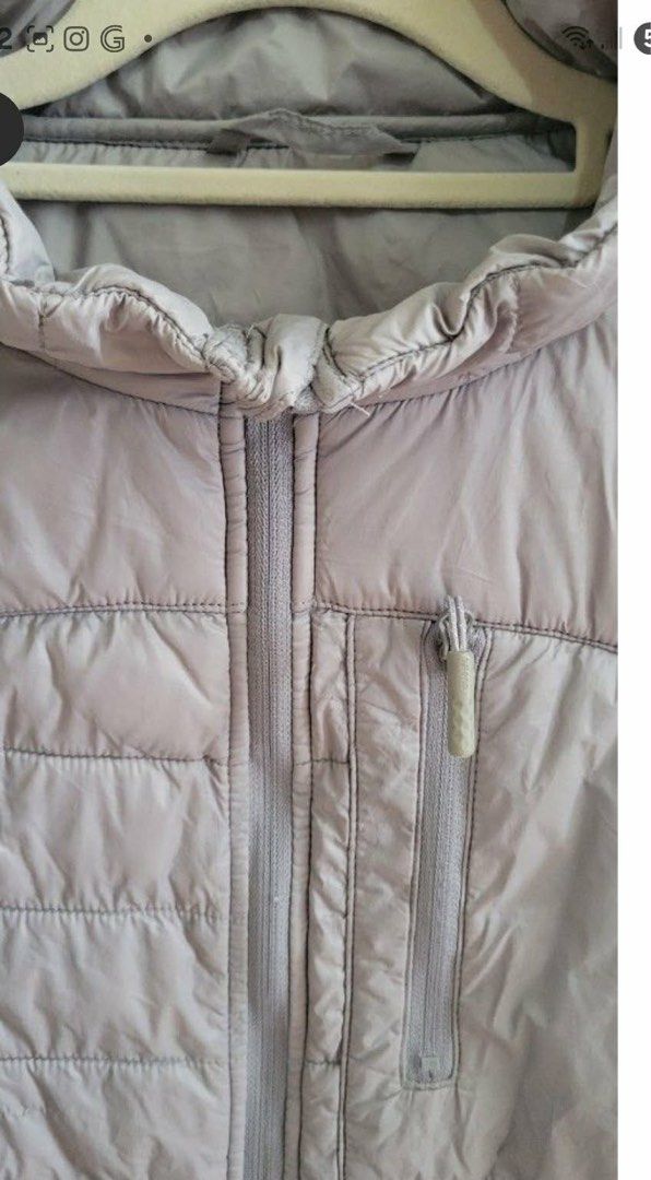 Lightweight Grey Puffer Jacket (Category: Coats, Jackets and Outerwear) located in Manila. Submitted by Mimi020623 (Listing ID 1460018268, Image 3). Description: - Grey puffer jacket - Full front zipper closure - Two zippered side pockets - One zippered chest pocket - Lightweight and warm material - Ideal for layering.
