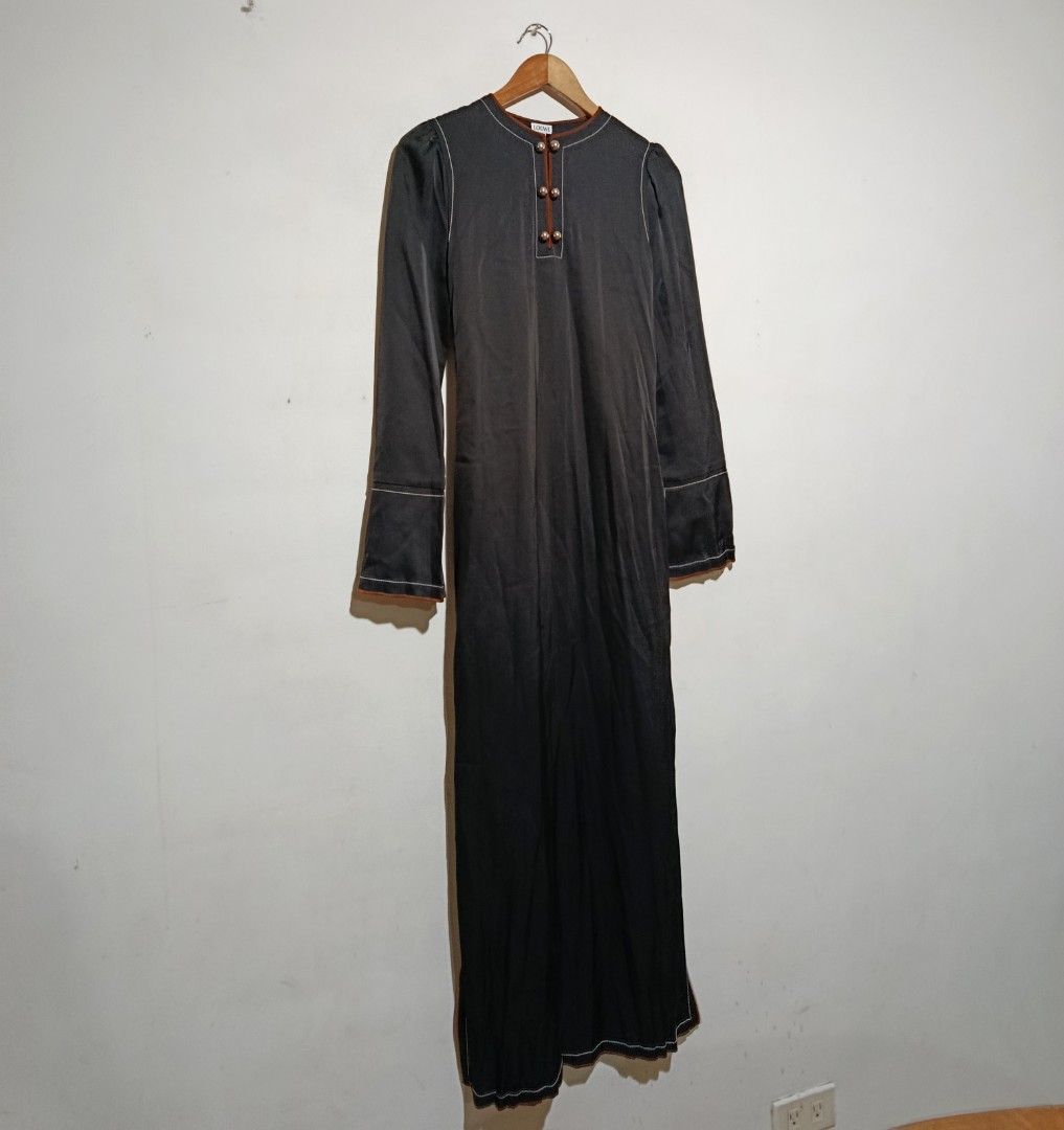 Loewe - Black Crew Neck Long Dress (Category: Dresses) located in San Fernando. Submitted by son.twice.stuff (Listing ID 1460053556, Image 2). Description: Item: Loewe - Black Crew Neck Long Dress Tagged Size: 34 Fit Small Dimensions Length: 55" Armpit To Armpit: 14" Waistline: 14" Shoulder: 13" Sleeve: 25" Condition: Excellent Zipper: YKK Puller: LOEWE Made In Italy Material 65% Triacetate 35% Polyester Price: 12800 Free Shipping.