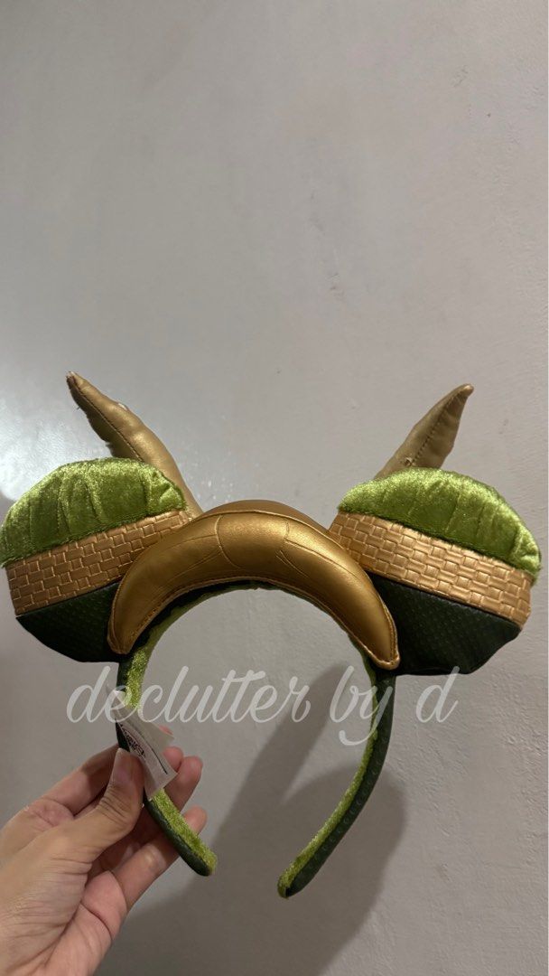 Loki Mischievous Ears Disney Headband (Category: Character Goods) located in Muntinlupa City. Submitted by declutter.by.d (Listing ID 1460040431, Image 1). Description: - Loki Mischief Ears Headband - Features iconic green and gold colors - Includes Loki's signature horns - Officially tagged with Marvel and Disney - Ideal accessory for any Marvel or Loki fan - As is.