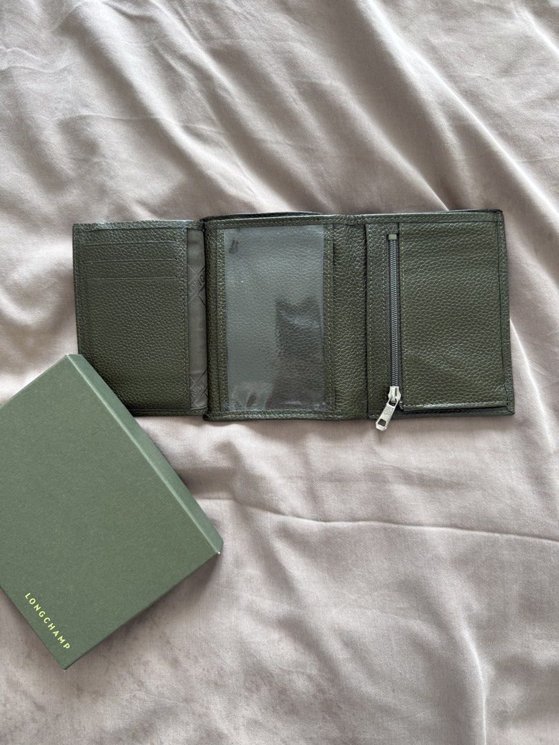 Longchamp Green Leather Bifold Wallet (Category: Luxury Bags & Wallets) located in Cebu City. Submitted by takeitfrom.me (Listing ID 1459946205, Image 3). Description: - Authentic Longchamp green leather bifold wallet - Textured pebble leather finish - Compact and pocket-friendly design - Classic and simple style - Ideal for everyday use.