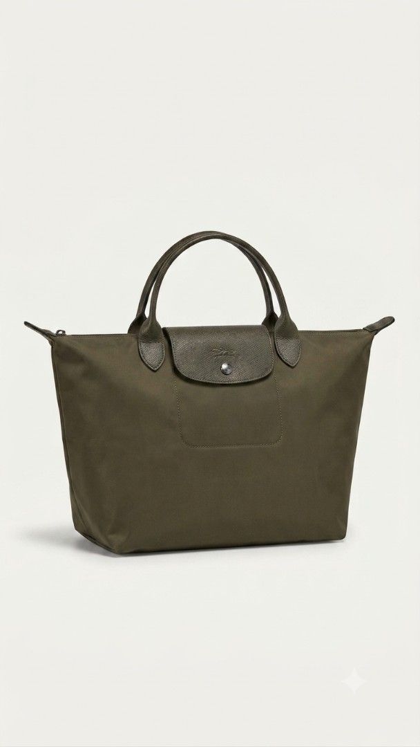 Longchamp Le Pliage Neo Top Handle Bag (Category: Luxury Bags & Wallets) located in Manila. Submitted by youngturtle.8e129a (Listing ID 1460101813, Image 1). Description: - Authentic Longchamp Le Pliage Neo Top Handle bag - Color: Olive Green - Material: Durable nylon with leather trim - Features: Spacious interior, secure zipper and snap closure - Condition: All zippers and snaps are working well - Ideal for: Everyday use, carrying daily essenti