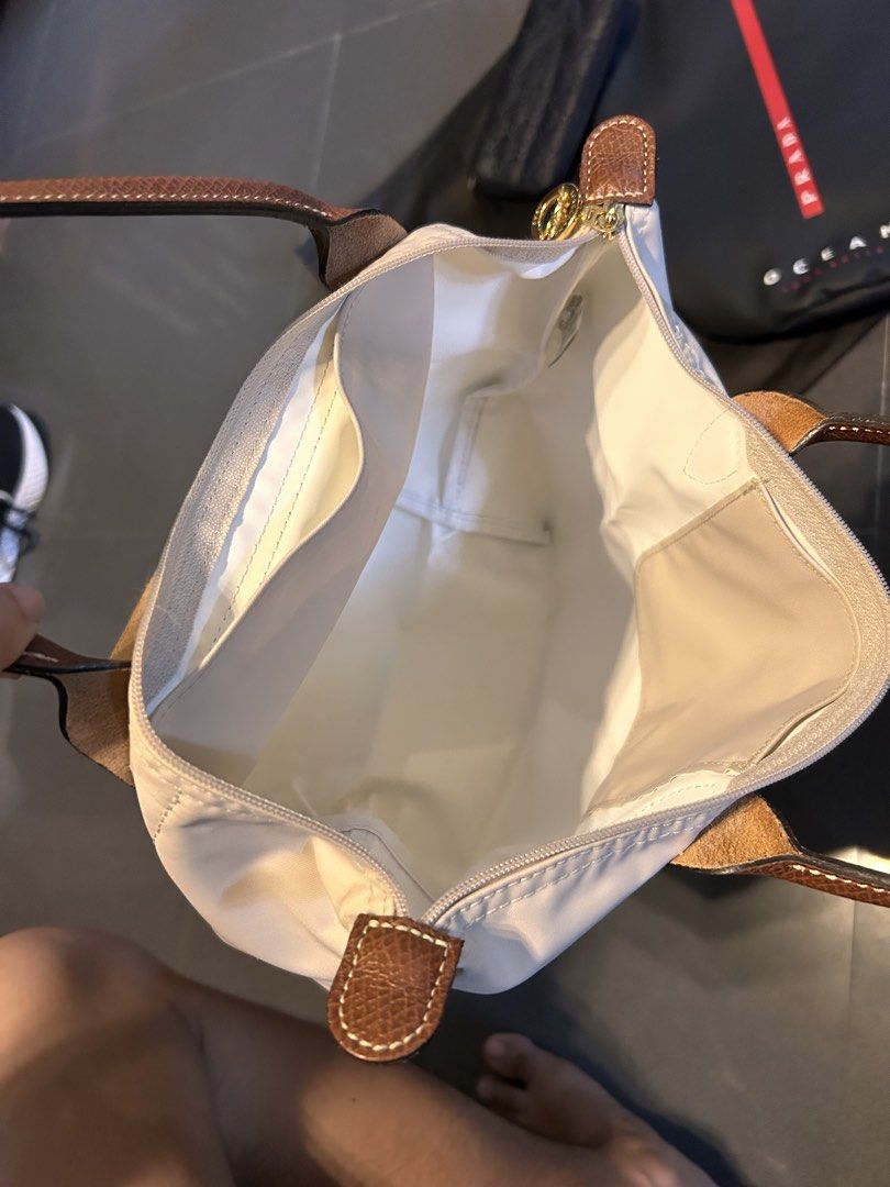 Longchamp Le Pliage Top Handle Bag Beige (Category: Luxury Bags & Wallets) located in Quezon City. Submitted by jaypee.abergas (Listing ID 1460046028, Image 3). Description: - Authentic beige Longchamp Le Pliage Cuir small top handle bag - Genuine leather trim and handles Used twice only Close to new condition Dm.