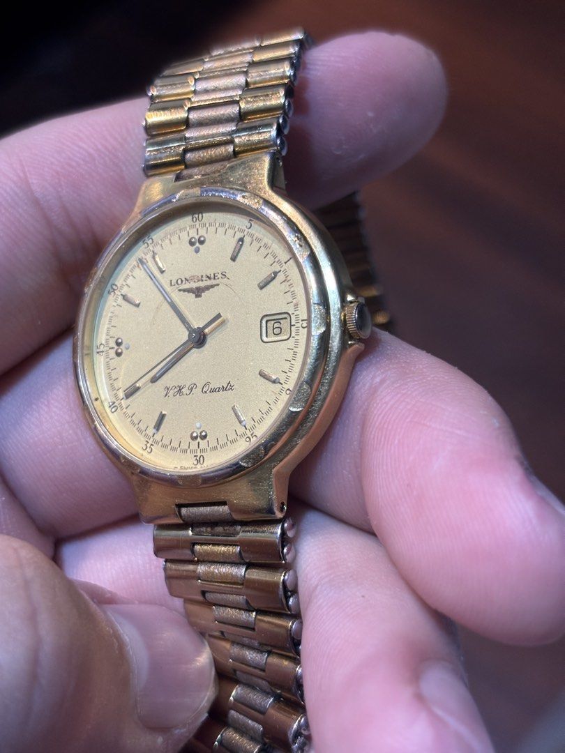 Longines Conquest VHP gold tone watch (Category: Luxury Watches) located in Manila. Submitted by maxxxxxxxxxxxx (Listing ID 1459916313, Image 3). Description: For sale Authentic Swiss Longines Very high precision Conquest Gold tone mens watch Nice and large bracelet Good running condition Crown was just replace and patina on dial please see pics Thats why selling cheap.