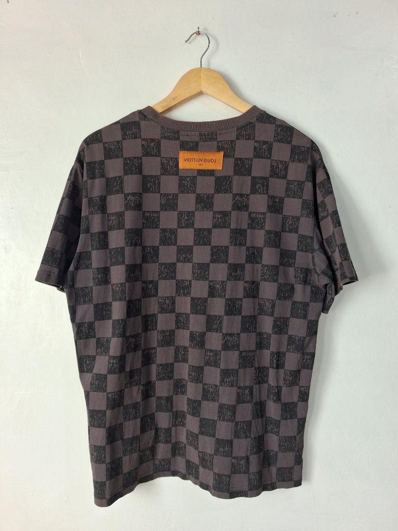 Louis Vuitton 2021 Marque Damier Tee (Category: Luxury Apparel) located in Makati City. Submitted by seller_102 (Listing ID 1459999708, Image 2). Description: Brand: Louis Vuitton Dimes: 22in x 27.5in Issue: 1 Pinhole Color Rate: 9.5/10 Condition: Very Good.