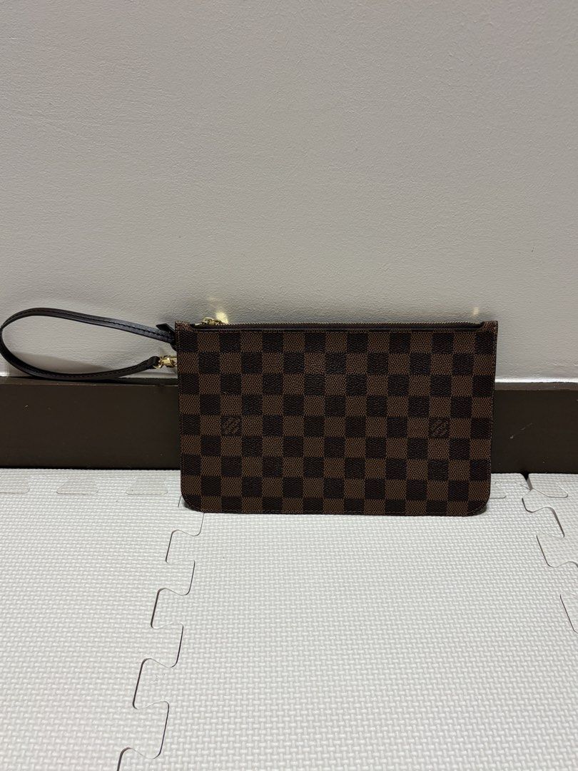 Louis Vuitton Damier Ebene Neverfull Pouch (Category: Luxury Bags & Wallets) located in Pasig City. Submitted by ivanvibal (Listing ID 1460030135, Image 1). Description: Good as new Meet up transaction only.