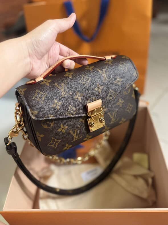 Louis Vuitton East West Metis Monogram (Category: Luxury Bags & Wallets) located in Taguig. Submitted by authenticniceseller (Listing ID 1459903244, Image 3). Description: - Authentic Louis Vuitton Pochette Metis - Iconic Monogram Canvas - 2 straps: Gold Chain Strap and adjustable leather strap - Leather Top Handle - Includes Original Box - Includes Dust Bag - Timeless and classic piece.