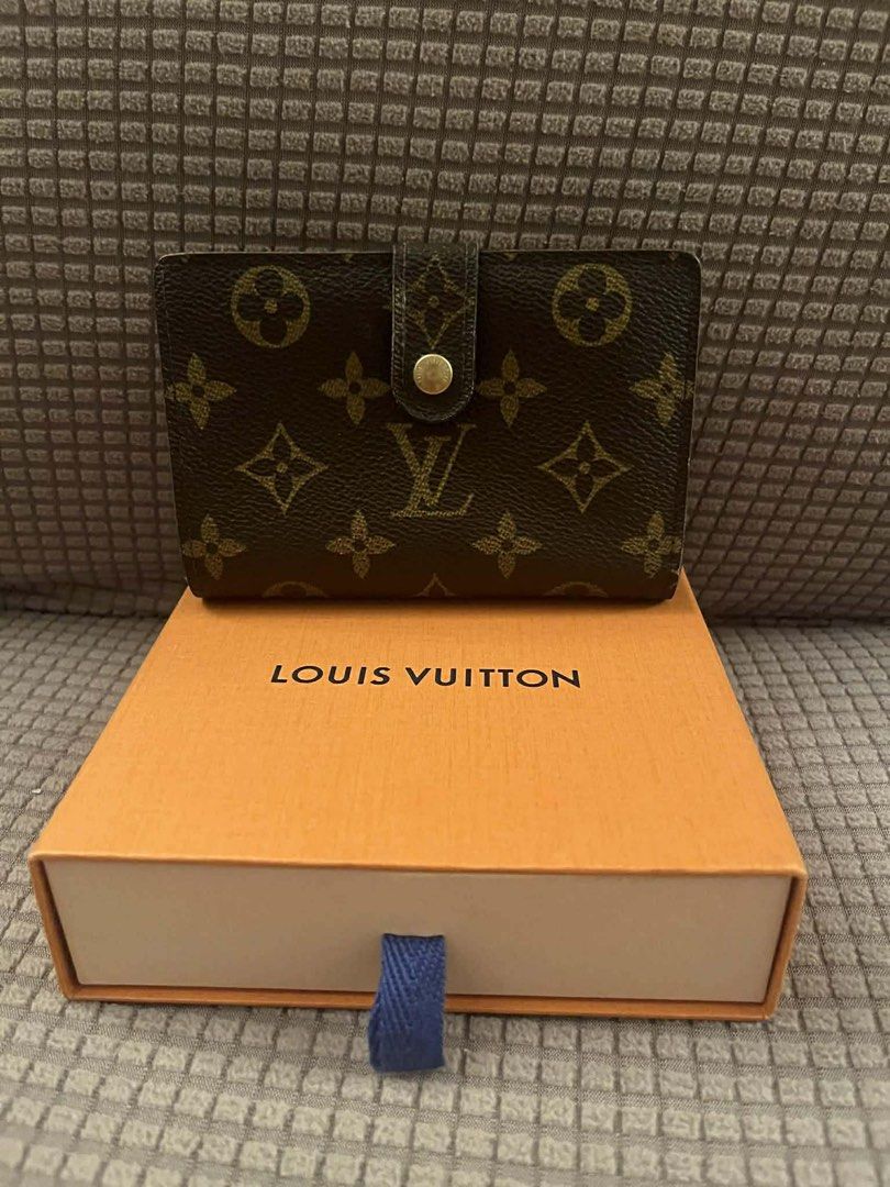Louis Vuitton Monogram Canvas Wallet with Box (Category: Luxury Bags & Wallets) located in Manila. Submitted by chantalsalonga (Listing ID 1460090166, Image 1). Description: - Classic Louis Vuitton monogram wallet - Color: Brown canvas with iconic LV pattern - Closure: Secure snap closure - Includes: Original Louis Vuitton orange box - Functionality: Ideal for organizing cards and cash.