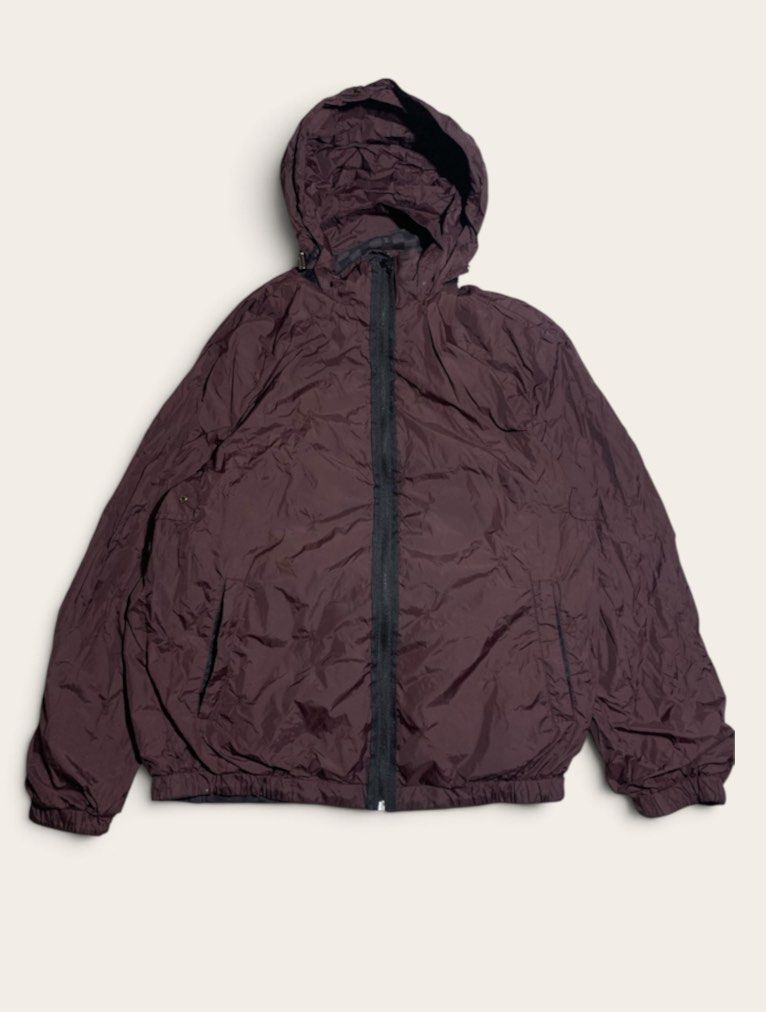Louis Vuitton Monogram Checkerboard Reversible Jacket (Category: Luxury Apparel) located in Davao. Submitted by youngboythrift25 (Listing ID 1460041897, Image 1). Description: - Louis Vuitton reversible jacket - Iconic checkerboard monogram pattern on one side - Plain dark maroon with hood on the other side - Zipper closure - Pockets on both sides - Ideal for versatile layering.
