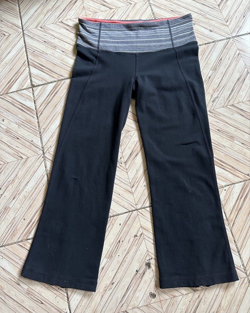 Lululemon Black Crop Pants Size 4 (Category: Activewear) located in Manila. Submitted by alejeong27 (Listing ID 1460094534, Image 2). Description: - Black Lululemon crop pants - Size 4 - Fold-over waistband with grey and white stripes - Small Lululemon logo on left leg - Slit detail at the hem - Comfortable for workouts or casual wear.