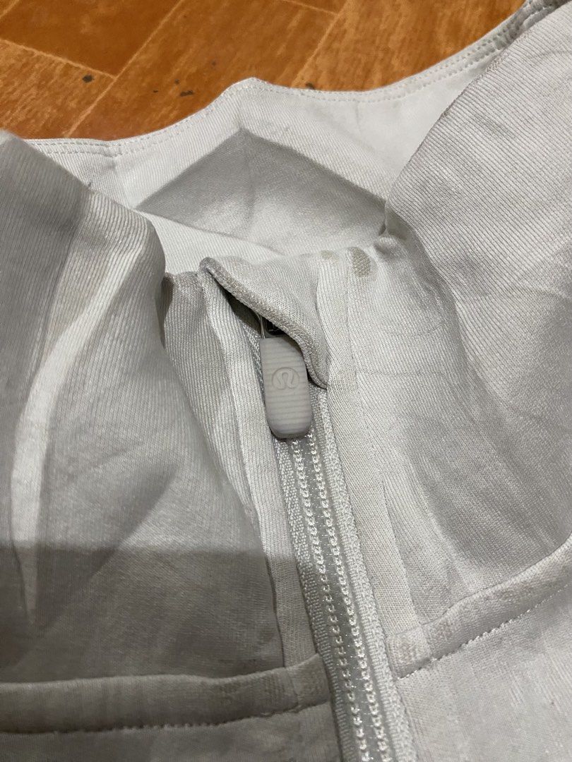 Lululemon Grey Quarter Zip Pullover Sweater Size 12 (Category: Coats, Jackets and Outerwear) located in Manila. Submitted by jairusdave65695 (Listing ID 1460059711, Image 2). Description: - Grey Lululemon quarter zip pullover - Size: 12 - Features a kangaroo pocket - High neck design - Material: Recycled polyester, modal, elastane - Ideal for workouts and casual wear.