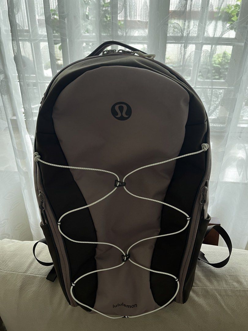Lululemon Scuba Backpack 32L Paracord (Category: Backpacks) located in Muntinlupa City. Submitted by nfj25 (Listing ID 1460071568, Image 3). Description: 🎒Lululemon backpack in stylish taupe and brown 🎀 Front bungee cord detail for extra storage or style. 💧Convenient side pockets for water bottles or essentials. 🥾Ideal for gym, school, or everyday adventures. Used only once! Tag unattached but included!! 🏷️ Price slightly negotiable.
