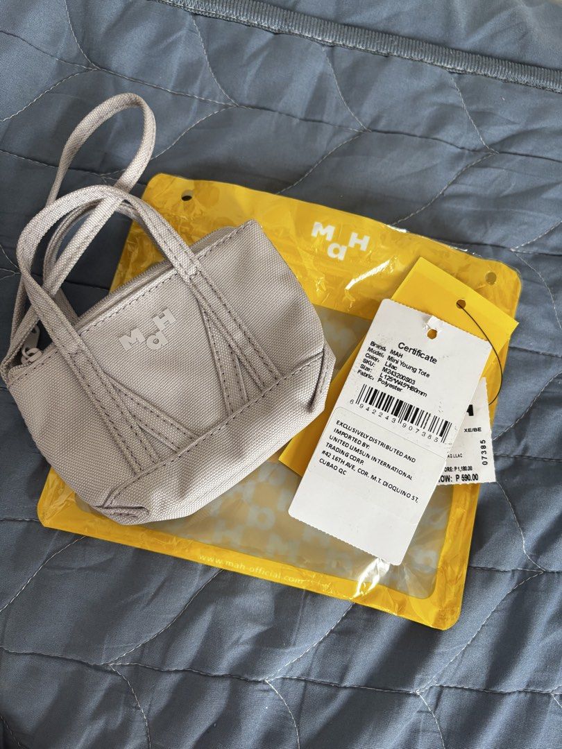 MAH Mini Young Tote (Category: Purses & Pouches) located in Manila. Submitted by declutter_byjaq (Listing ID 1459990727, Image 1). Description: MAH Mini Young Tote Color: Lilac Bought at MAH Robinsons Manila Impulsive Buy 💜 RFS: Needs Cash.