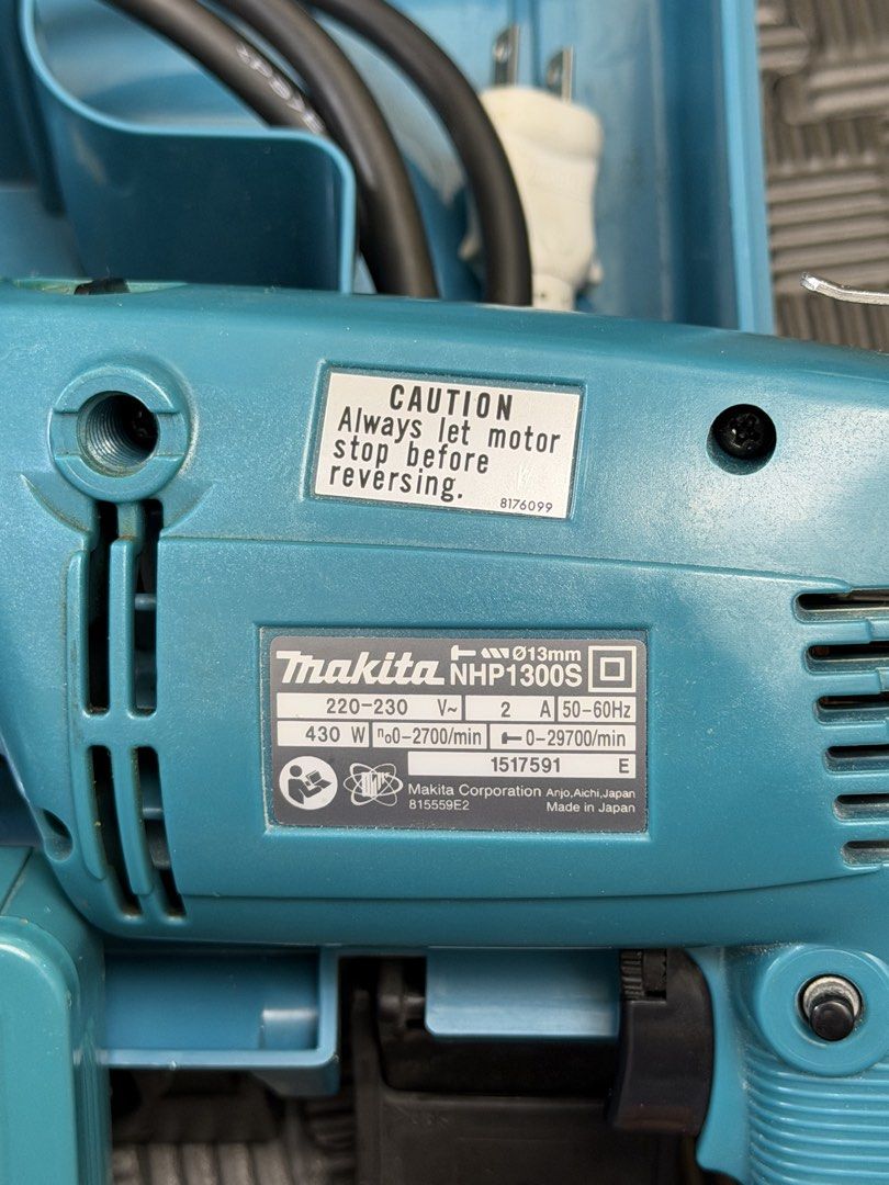 Makita Hammer Drill NHP1300S with Drill Bits and Case (Category: Construction Tools & Equipment) located in Manila. Submitted by mommyzel (Listing ID 1459970568, Image 3). Description: - Makita NHP1300S Hammer Drill - Powerful 430W motor - Variable speed: 0-2700 RPM - Comes with a set of drill bits - Includes original case for storage - Auxiliary handle for better control - Ideal for various drilling applications.