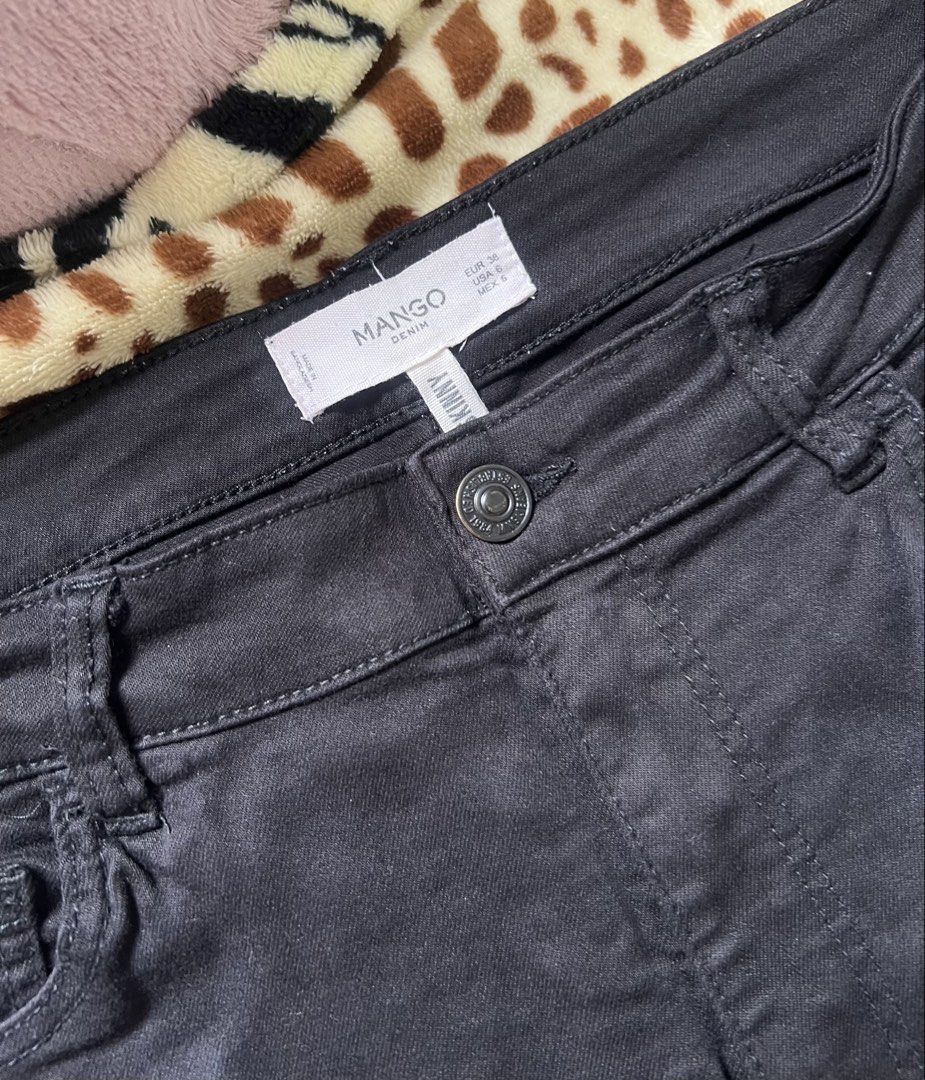 Mango Black Skinny Ripped Jeans (Category: Jeans) located in Quezon City. Submitted by marys_collection (Listing ID 1459998620, Image 2). Description: - Brand: Mango - Style: Black skinny jeans - Features: Rips on the front, small metal detail on back pockets - Occasion: Great for casual wear.